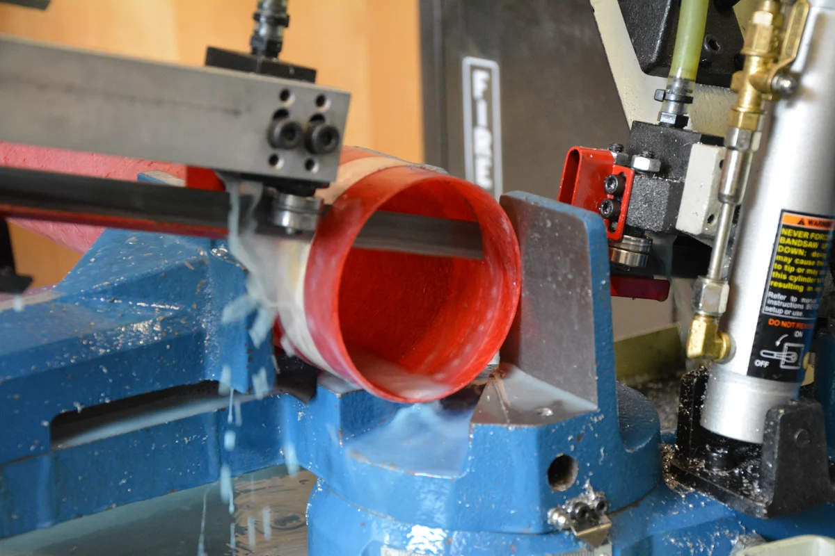 Construction of booster section of Astrohawk II. Cutting of fiberglass airframe with wet band saw.