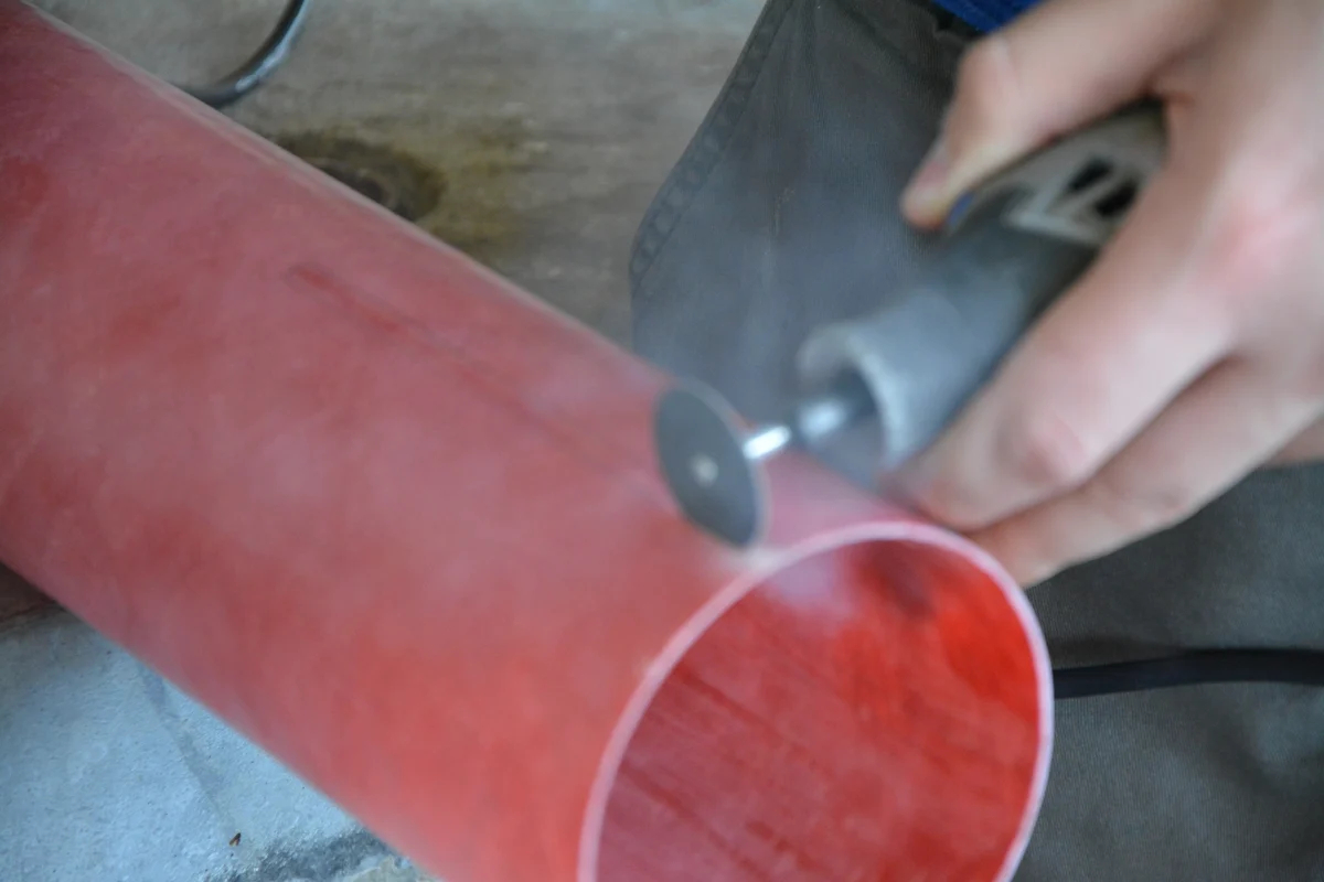 Construction of booster section of Astrohawk II. Cutting fin slots with dremel.